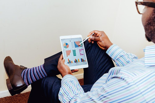 An Accountant Viewing Graphs On A Mobile Device